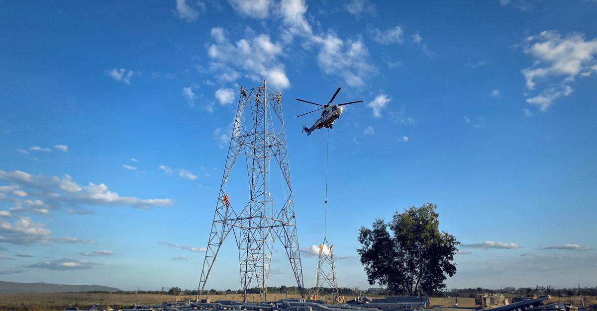 image of a helicopter over land